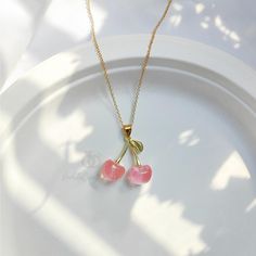 Welcome to my store Pink Cherry Necklace PRODUCT DETAILS Come with 1PcNecklace Length: 45cm Material:  Pendant: Resin, Chain: 18K Gold, Other accessories: Alloy Color: Gold Style: Cartoon Occasion: Perfect for any special occasions and events Note - The color displayed may vary slightly depending on your screen Take a first step to a more colorful life with funny ring. ★ Standard transport time★ I need 3-5 working days for production US:About 10-24 days to transport UK,CA,AU,FR:13-26 days to transport Other：30 days Upgrade logistic method Express shipping: takes about 9-16 days for delivery Fedex shipping: takes about 5-8 days for delivery Note:please leave your phone number when you chose express or Fedex shipping, it is needed for express shipping company Please contact me if you can't t Trendy Gold Plated Charm Necklace For Gift, Pink Round Pendant Gold Plated Jewelry, Pink Gold-plated Round Pendant Jewelry, Pink Gold Plated Round Pendant Jewelry, Trendy Round Jewelry As Gift, Trendy Round Jewelry For Gift, Trendy Round Jewelry For Gifts, Trendy Pendant Jewelry For Gifts, Trendy Jewelry For Valentine's Day Gift