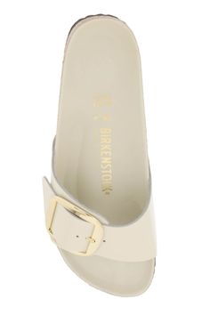 BIRKENSTOCK Madrid Big Buckle slides in patent leather with silver-finished metal large buckle with debossed logo. Leather-covered semi-exquisitinsole, anatomically shaped cork-latex footbed, EVA outsole. Narrow fit. Size Info IT Color Detail White Made In Germania Material 100% leather Season One fall Season Two winter Product shoes Brand Birkenstock Size And Fit Heel Height = 3,5 Modern Mules With Tang Buckle And Round Toe, Classic Slides With Buckle Closure, Classic Flat Slides With Buckle Closure, Modern Slip-on Footbed Sandals With Buckle Closure, Classic Slides With Buckle Closure For Spring, Classic Spring Clogs With Buckle Closure, Madrid Big Buckle, Birkenstock Madrid Big Buckle, Latest Fashion Design