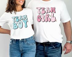 "💙 Get ready for the ultimate gender reveal celebration with our Retro Gender Reveal Shirt! This trendy T-shirt is perfect for the whole family and features \"Team Boy\" and \"Team Girl\" designs. Whether you're hosting a baby shower or want to add excitement to your gender reveal, our versatile and stylish Gender Reveal Group Shirt is a must-have. Grab yours now and let the anticipation begin! 👕 PRODUCT INFO The Bella + Canvas shirts are super soft and comfy! These t-shirts are made of light fabric and have ribbed knit collars to bolster shaping. They are extremely durable, and will withstand years of repeat washing and wearing. Shoulders, sleeves, and hems have taping for better fit over time. ✏️ DESIGN Designs are printed onto the shirt using Direct to Garment (DTG), which means the i Cheap Funny T-shirt For Gender Reveal, Cheap Family Matching T-shirts For Gender Reveal, Cheap Cotton Shirt For Gender Reveal, Cheap Cute T-shirt For Gender Reveal, Gender Reveal Shirt Ideas For Parents, Cheap Custom Print Top For Gender Reveal, Gender Reveal Shirts For Parents, He Or She Gender Reveal, Keeper Of The Gender