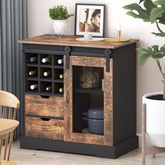 a wooden cabinet with wine bottles in it and a potted plant next to it