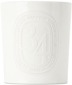 a white cup with the number forty four on it's side and an embossed seal