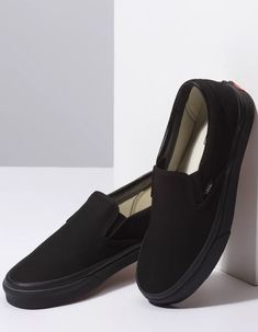 Vans Classic Slip-On shoes. The Canvas Classic Slip-on has a low profile, slip-on canvas upper with elastic side accents, Vans flag label and Vans original Waffle Outsole. Imported. Black Closed Toe Slip-ons With Rubber Sole, Black Closed Toe Casual Slip-ons, Casual Black Slip-ons With Flat Heel, Black Slip-ons With Rubber Sole, Black Slip-ons With Rubber Sole And Flat Heel, Black Slip-ons With Rubber Sole And Round Toe, Black Synthetic Slip-ons For Streetwear, Casual Black Synthetic Slip-ons, Black Closed Toe Slip-ons With Cushioned Footbed