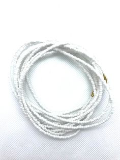 Beautiful vibrant white waist beads, gorgeous on any skin tone! These waist beads have metallic clasps.Waist beads, Boho waist beads, African waist beads, Belly Chain, Boho Beads, Belly Beads - White Waist Beads**** PROPERLY MEASURE YOUR WAIST ****Place the measuring tape at the exact area you prefer to wear the waist beads.Do not tuck in your stomach when measuring for belly chain.Allow for wiggle space when measuring for breathing room.Thank you for shopping with us! Adjustable White Beaded Chain Waist Beads, Adjustable White Beaded Waist Beads, Adjustable White Waist Beads, Festival White Beaded Chain Waist Beads, White Waist Beads With Tiny Beads As A Gift, White Beaded Waist Beads As A Gift, White Tiny Beads Waist Jewelry For Festival, White Beaded Waist Beads As Gift, Adjustable White Waist Beads With Spacer Beads