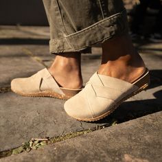 With soft, interwoven suede uppers and a cork-based sole, Daniella is sure to be your go-to mule. Everyday Suede Sandals With Leather Footbed, Suede Slip-on Sandals With Woven Sole, Everyday Suede Mules With Leather Footbed, Casual Everyday Mules With Leather Sole, Beige Suede Closed Toe Clogs, Casual Beige Mules With Leather Footbed, Comfortable Closed Toe Mules With Suede Lining, Casual Beige Clogs With Leather Sole, Beige Suede Casual Clogs