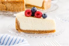 a slice of cheesecake with berries on top