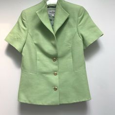 Valentino linen blazer perfect for spring.  Soft green with gold tone button front, winged collar, short sleeves and fully lined.  Made in Italy and tagged size 44.  Measures, 14" shoulder to shoulder, 8.5" sleeve, 36" bust, 30" waist, 38" hips and 22" shoulder to hem. For additional merchandise, please visit: https://www.ebay.com/str/eleganciatoo Classic Short Sleeve Outerwear For Formal Occasions, Classic Short Sleeve Outerwear For Formal Events, Classic Short Sleeve Fall Blazer, Classic Fitted Short Sleeve Outerwear, Wing Collar, Linen Crops, Linen Blazer, Green Shorts, Green Jacket