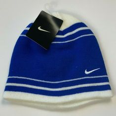 Authentication:  100% Authentic Nike merchandise Hat Description:  Royal blue and white beanie winter hat no cuff Hat Design:  Horizontal royal blue and white stripes with Nike logo embroidered in white on the front Hat Material:  100% Acrylic - Warm and comfortable - Machine washable Hat Size:   Youth boys 8/20 Status:  Brand NEW! Tags:  Official Nike tag still attached! Shipping:  FREE Via USPS!  BUY WITH CONFIDENCE – 100% POSITIVE FEEDBACK!  Check out my eBay store at stores.ebay.com/officerb Classic Blue Winter Hat, Warm Sports Beanie Hat, Blue Outdoor Beanie Hat, Outdoor Blue Beanie Hat, Winter Sports Hat, Blue Winter Beanie Cap, Warm Blue Cap, Nike Winter Beanie Hat, Blue Beanie Hat One Size Fits Most