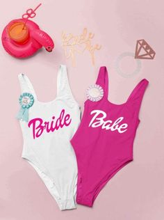 two swimsuits with bride and bachelor written on the front, one in pink and one in white