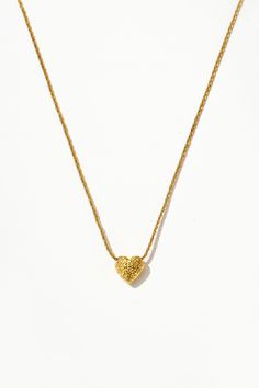 Wear your heart on your neckline! Crafted with love, this 18k gold necklace features a dazzling gold heart pendant. Whether you're spreading love vibes at brunch or stealing the show at date night, this necklace is sure to be your new fave accessory! Gold Heart Necklace With Heart Print For Valentine's Day, Gold Heart Pendant Necklace With Heart Print, Gold Heart Necklace With Heart Pendant, Gold Necklace With Double Heart And Heart Print, Gold Charm Necklace With Heart Detail For Valentine's Day, Gold Charm Necklaces With Heart Detail For Valentine's Day, Gold Heart Print Jewelry For Valentine's Day, Dainty Gold Jewelry With Heart Print, Gold Heart Print Jewelry For Mother's Day