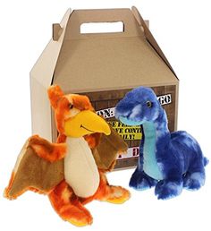 two stuffed animals sitting next to a cardboard box