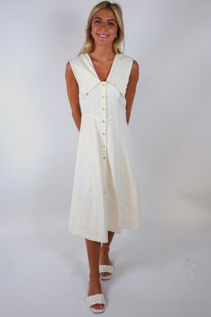 Elevate your style with our Margaret Midi Dress! This elegant ivory dress features a chic big collar and a button-up front, making it the perfect blend of sophistication and comfort. Stand out from the crowd and make a statement with this must-have piece in your wardrobe. Size + Fit Riley is 5’7” and wearing a size Small Content + Care 100% Cotton Lining: 100% Rayon Dry Clean Only Sneaker Heels Wedges, Matching Sets Outfit, Big Collar, Ivory Dress, Ivory Dresses, Stand Out From The Crowd, Top Sales, Dress Romper, Elevate Your Style