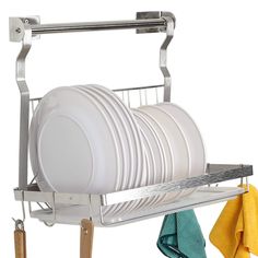 the dish rack is holding two dishes and three yellow towel holders on it's sides