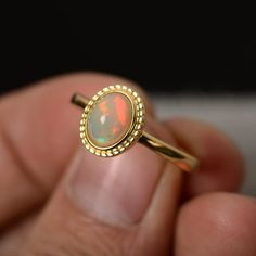 Natural Opal Ring Sterling Silver Yellow Gold Plated Oval Cabochon Opal Ring With Polished Finish, Oval Cabochon Opal Ring Fine Jewelry, Oval Cabochon Opal Ring In Fine Jewelry, Fine Jewelry Oval Cabochon Opal Ring, Ethiopian Opal Oval Rings For Anniversary, Polished Opal Ring In Oval Cabochon Shape, Opal Oval Cabochon Ring With Polished Finish, Anniversary Opal Ring With Oval Cabochon, Anniversary Oval Cabochon Opal Ring With Polished Finish