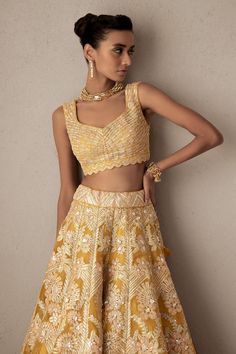 Mango kalidar lehenga with all-over hand metallic pop-floral multi embroidery. Comes with embroidered sleeveless blouse and border embroidered dupatta.
Component: 3
Pattern: Embroidery
Type Of Work: Hand metallic Pop-Floral multi embroidery
Neckline: V neck
Sleeve Type: Sleeveless
Fabric: Silk Organza and Indian Tulle
Color: Yellow
Other Details: 
Blouse with saw tooth cutwork hem
Sheer dupatta with floral embroidery on the border
Low back with tie up and tassels
Occasion: Mehendi and Haldi - Az Sheer Dupatta, Embroidery Neckline, Tulle Embroidery, Embroidered Dupatta, Pattern Embroidery, Silk Organza, Fabric Silk, Cut Work, Aza Fashion