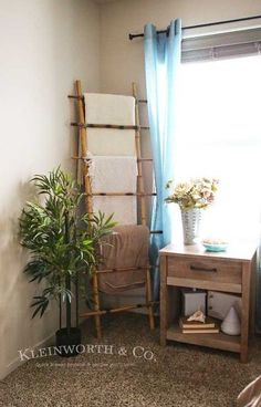 a room with a chair, table and plants in it