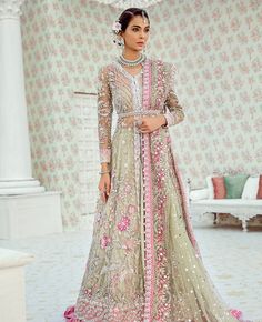 This wedding jacket is hand-worked with pearls, Swarovskis, dabka, nakshi, kora, gold sequins, and crystals. It is matched with a Carnation Pink Color Organza Skirt with embroidered and embellished dupatta finished with a four-sided border. Lehenga can be customized in any color of your choice. Net Suit, Pakistan Bridal, Latest Pakistani Dresses, Pakistan Wedding, Pakistani Women Dresses, Walima Dress, Pakistani Dresses Online, Pakistani Designer Suits, Pakistani Fashion Casual