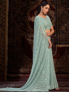 Elevate your ethnic wardrobe with our stunning "precious sea green sequins georgette party wear saree with blouse." This exquisite saree is designed to make you the center of attention at weddings, festivals, parties, and other special occasions. The sea green color paired with intricate sequin work adds a touch of glamour and sophistication to your ensemble.
Crafted from high-quality georgette fabric, this saree drapes beautifully and exudes elegance. The sequin work adds a touch of sparkle and Festive Pista Green Pre-draped Saree For Party, Pista Green Georgette Pre-draped Saree For Navratri, Party Wear Georgette Pre-draped Saree For Eid, Green Georgette Party Wear Saree, Green Georgette Saree For Party Wear, Party Wear Green Georgette Saree, Green Zari Work Saree For Party Wear, Green Saree With Zari Work For Party Wear, Party Wear Georgette Saree For Reception