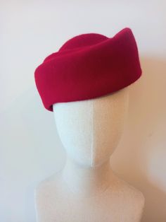 The Classic Pillbox Beret is a stunning vintage-style women's hat, handcrafted with utmost precision from premium quality red wool felt. This timeless accessory is designed to add a touch of elegance and sophistication to any outfit, making it perfect for formal events or adding a chic statement to your everyday attire. The pillbox shape offers a flattering silhouette, while the beret design adds a trendy twist. The luxurious red wool felt exudes warmth and durability, ensuring long-lasting wear Beret Design, Felt Beret, Elegant Hats, Pillbox Hat, Outfit Making, Pill Boxes, Timeless Accessories, Beautiful Hats, Red Wool