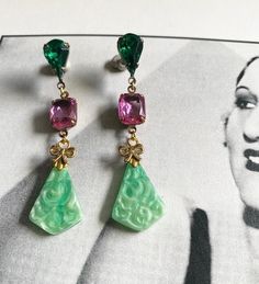 "Art Deco statement earrings in Ornate Bohemian  style With sparkly paste rhinestones  and two beautiful vintage carved Czech glass jade pendant stones  Earrings look lovely on  Earrings have  posts with lever backs and are gold plated  for pierced ears, lead & nickel free In excellent condition Size: just over  2 & 1/4\" (6cm) long ,  these are quite long so please check size before buying" Art Noveau Earrings, Art Deco Dangle Pierced Earrings, 1920s Bohemian, Nickel-free Art Deco Metal Earrings, Handmade Art Nouveau Drop Earrings Jewelry, Nickel-free Art Deco Dangle Earrings, 1920 Art, Flapper Art, Stones Earrings