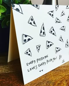 there is a card with pizza slices on it