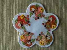 a close up of a patch with flowers on it