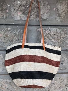 A beautiful brown and white stripes handbag made of sisal with leather handles.Made of extrafine grain sisal.Great for a day out or a gift to loved one.DimensionsLargeShipmentShips via DHLTakes 3-7 days depending with the destinationWholesale ordersAvailableCustom ordersAvailableThank you so much for shopping with us! Casual Striped Rectangular Straw Bag, Striped Rectangular Shoulder Bag For Travel, Striped Rectangular Beach Bag For Shopping, Striped Rectangular Beach Bag For Everyday Use, Striped Tote Beach Bag For Shopping, Striped Rectangular Vacation Bag, Daily Use Striped Bag With Double Handle, Striped Rectangular Beach Bag, Striped Double Handle Bag For Daily Use