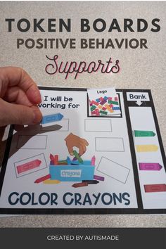 a hand holding a piece of paper that says, token boards, positive behavior supports