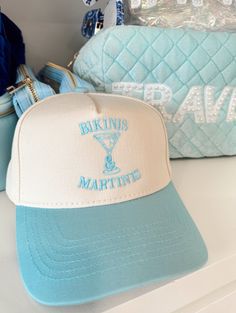 Whether you're sipping martinis under the palm trees or lounging by the pool, let this hat be your go-to accessory for the best summer vibes, one bikini and martini at a time! Now available in baby blue! Cute Beach Trucker Hat, Fun Trucker Hat For Beach Season, Bach Party Trucker Hats, Bachelorette Trucker Hats, Retro Trucker Hat For Beach, One Size, Vintage Trucker Hat, Vintage Trucker Hats, Bachelorette Decorations, School Collection