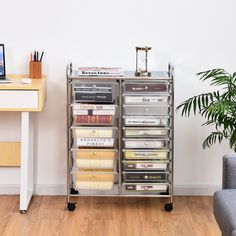 a desk with a computer and some files on it