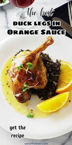 the best duck leg in orange sauce is served with rice and lemon wedges for an entree