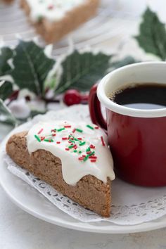 a cup of coffee next to a piece of cake