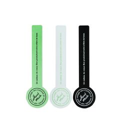 three different colored tags with black, white and green labels