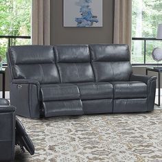 a living room scene with focus on the reclining sofa