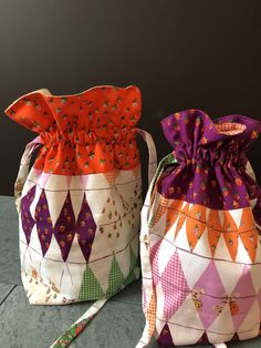 two colorful bags sitting next to each other