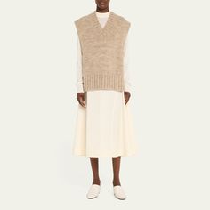 Maison Margiela knit sweater vest V neckline Cap sleeves Relaxed fit Open sides Pullover style Alpaca/cotton/wool Made in Italy Sweater Vest Open Sides, Fine Knit Sweater Vest For Work, Beige Sweater Vest For Workwear In Fall, Fitted Cashmere V-neck Sweater Vest, Cashmere V-neck Sweater Vest For Layering, V-neck Cashmere Sweater Vest For Work, Cashmere Fine Knit Sweater Vest For Fall, Casual Beige Cashmere Sweater Vest, Fine Knit Cashmere Sweater Vest For Fall