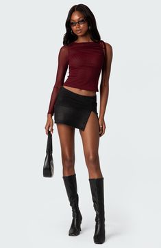 Rock an edgy night-out vibe in this asymmetric top designed with a single sheer sleeve and ruched accents. Jewel neck Single long sleeve 95% polyester, 5% spandex Machine wash, dry flat Imported Red Mesh Top, Visionary Fashion, Maroon Top, Swimwear Dress, Mesh Sleeves, Asymmetrical Tops, Shoulder Design, Peek A Boo, Sheer Sleeves