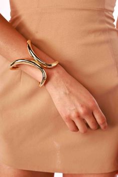 Add a touch of boldness to your ensemble with the Tall Hinged Cuff. Its unique shape and elegant hinge design create a striking statement that enhances any look. Bracelet type: Hinge cuff Bronx And Banco, Blue Mini Dress, Bronx, Hinges, Gold Bracelet, Cuff, Bracelet, Gold, Design