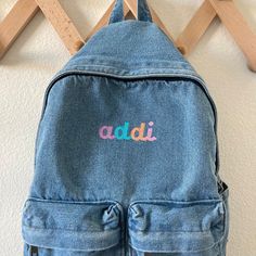 "The cutest backpack! I love how casual and simple these are. Choose from initial, name, or first and middle name on these lightweight denim bags. The back measures 15.7\" x 11.7\"8 and comes with two smaller front pockets, a main large pocket and adjustable shoulder straps. These backpacks are the perfect size for toddlers and kids but adults as well! If you are wanting a different design, size, more wording, or a different clothing style, please send me a message so we can discuss the details. Trendy Denim Blue Back To School Bag, Trendy Denim Blue Bags For Back To School, Trendy Embroidered School Backpack, Trendy Denim Blue School Backpack, Trendy Denim Blue Backpack, Denim Blue School Bag For Back To School, Denim Backpack For Back To School, Denim Blue School Backpack, Trendy Denim Bags For Back To School