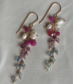 Gemstone Fluorite, Ruby, Fresh Water Pearl, 14k Gold Filled Wire Components.   -FLUORITE, RUBY EARRINGS are sold in pairs.  Price is per pair. -All components including the Ear Wire are 14k Gold Filled. -Earrings dangle approx. 2 1/8 inch (5.5 cm) -Full length approx. 2 5/8 inch (6.6 cm) -Weight  3.5 g (0.0035 kg) Pink Multi-stone Earrings For Anniversary, 14k Gold Briolette Earrings, 14k Gold Multi-stone Drop Earrings, Dangle Jewelry With Gemstone Accents For Anniversary, 14k Gold Jewelry With Gemstone Accents And Dangle Shape, Briolette Earrings With Natural Stones For Anniversary, Briolette Natural Stones Anniversary Earrings, Anniversary Earrings With Natural Stones In Briolette Shape, Anniversary Briolette Earrings With Natural Stones