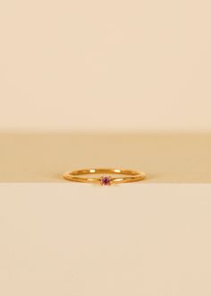 Perfect for making a subtle yet stylish statement. This elegant pinky ring features a dainty, pink cz centerpiece with a sleek band that comfortably hugs the pinky finger, adding a touch of style to any ensemble. Pink Cubic Zirconia18kt gold over brassBand width approx 1 mm Setting approx 2 mmSizes 3,4,5 Ring For Pinky Finger, Pinky Finger, Crystal Stickers, Earring Stand, Jewelry Candles, Crystal Candles, Fancy Jewelry, Pink Ring, Pretty Rings