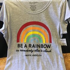 Brand New T-Shirt "Be A Rainbow In Someone Else's Cloud" Size Xl (15-17) Casual Rainbow Tops, Casual Pre-shrunk Rainbow T-shirt, Rainbow Graphic Tee, Pre-shrunk Rainbow Graphic Tee, Maya Angelou, New T, A Rainbow, Colorful Shirts, Womens Tops