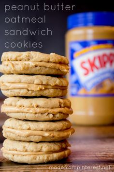 a stack of peanut butter oatmeal sandwich cookies next to a jar of peanut butter