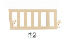 a wooden baby crib with the word hand made on it's bottom corner