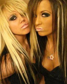 two beautiful young women standing next to each other with fake eyelashes on their face and nose