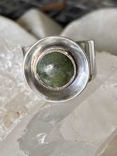 Circa 1950s Mid Century Modern Sterling Silver Disk Green Jade Stone Vintage Ring Sizable , curently at a size 7 Mid-century Gold Jewelry With Cabochon, Lime Green Sterling Silver Round Rings, Nickel-free Round Jade Jewelry, Jade Rings With Polished Finish, Oval Cabochon, Mid-century Green Collectible Jewelry, Usa Jewelry, Handcrafted Necklace, Jade Stone, Green Jade