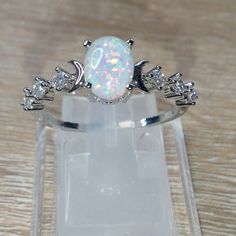 Gorgeous White Fire Opal Moon Cz Sterling Silver Plated Ring White Opal Crystal Promise Ring, White Round Celestial Jewelry, White Celestial Jewelry, White Oval Opal Crystal Ring, Celestial White Opal Jewelry, Adjustable White Oval Crystal Ring, Celestial White Promise Ring Jewelry, White Celestial Jewelry For Promise Ring, Adjustable White Celestial Rings