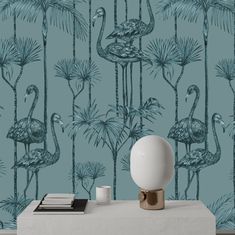 a wallpaper with flamingos and palm trees is shown in the background, along with a lamp on a table