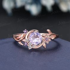 a ring with an amethorate and diamonds on it