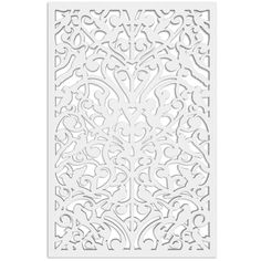 a white laser cutout with an intricate design on the front and back of it