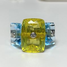 Vintage 18k White Gold 17.09ct Three Stone Citrine, Aquamarine Diamond Ring....Marked 18K....Size 5.5...Total of weights 10.7grams. It's in good condition. The center Citrine 17.8 x 12.7MM is 8+carat with two Aquamarines 12.2 X 10MM 4.5+ carat.  Each stone is pierced with a bezel set diamond in the center approx. 2MM each. Luxury Multi-stone Yellow Gemstones, Luxury Yellow Multi-stone Gemstones, Luxury Yellow Gemstones With Accent Stones, Luxury Yellow Diamond Gemstones, Modern Yellow Topaz Ring For Anniversary, Modern Yellow Topaz Anniversary Ring, Modern Yellow Gemstone Rings, Luxury Faceted Yellow Ring, Garnet Heart